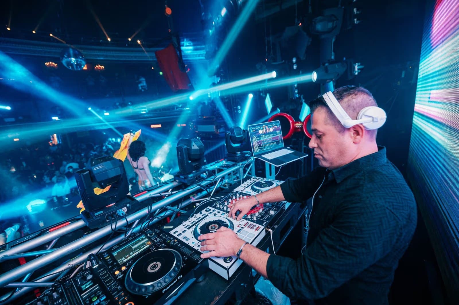 DJ Gilad Emesh performing to a packed nightclub crowd in Los Angeles