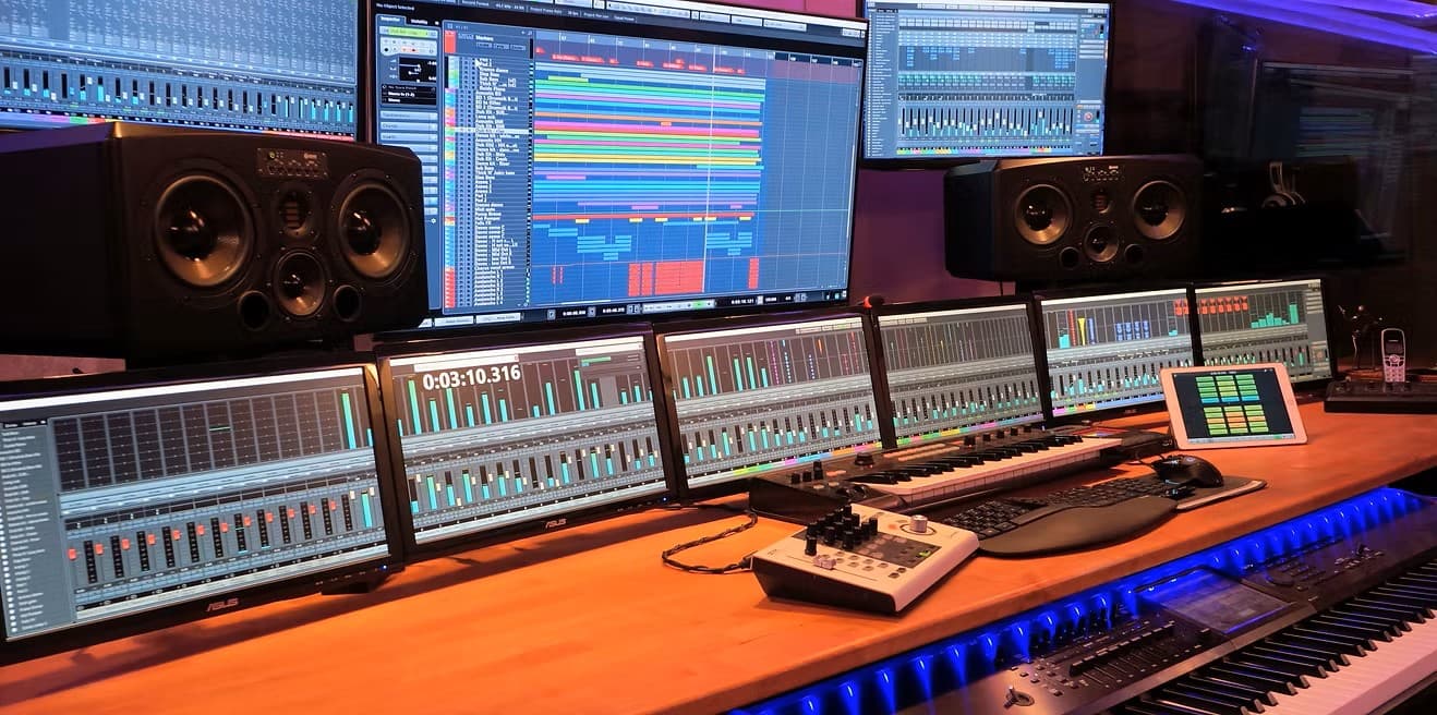 Professional mixing suite — multi-monitor DAW, studio monitors, MIDI keyboard, Los Angeles