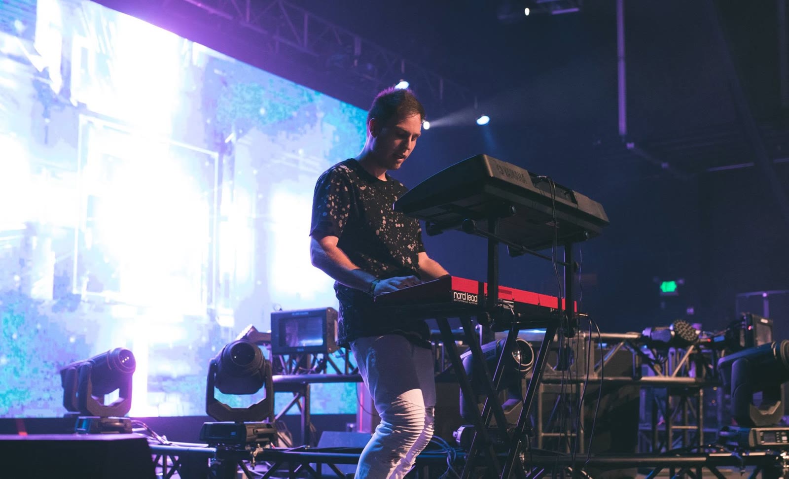 DJ Ori playing live keyboards on stage