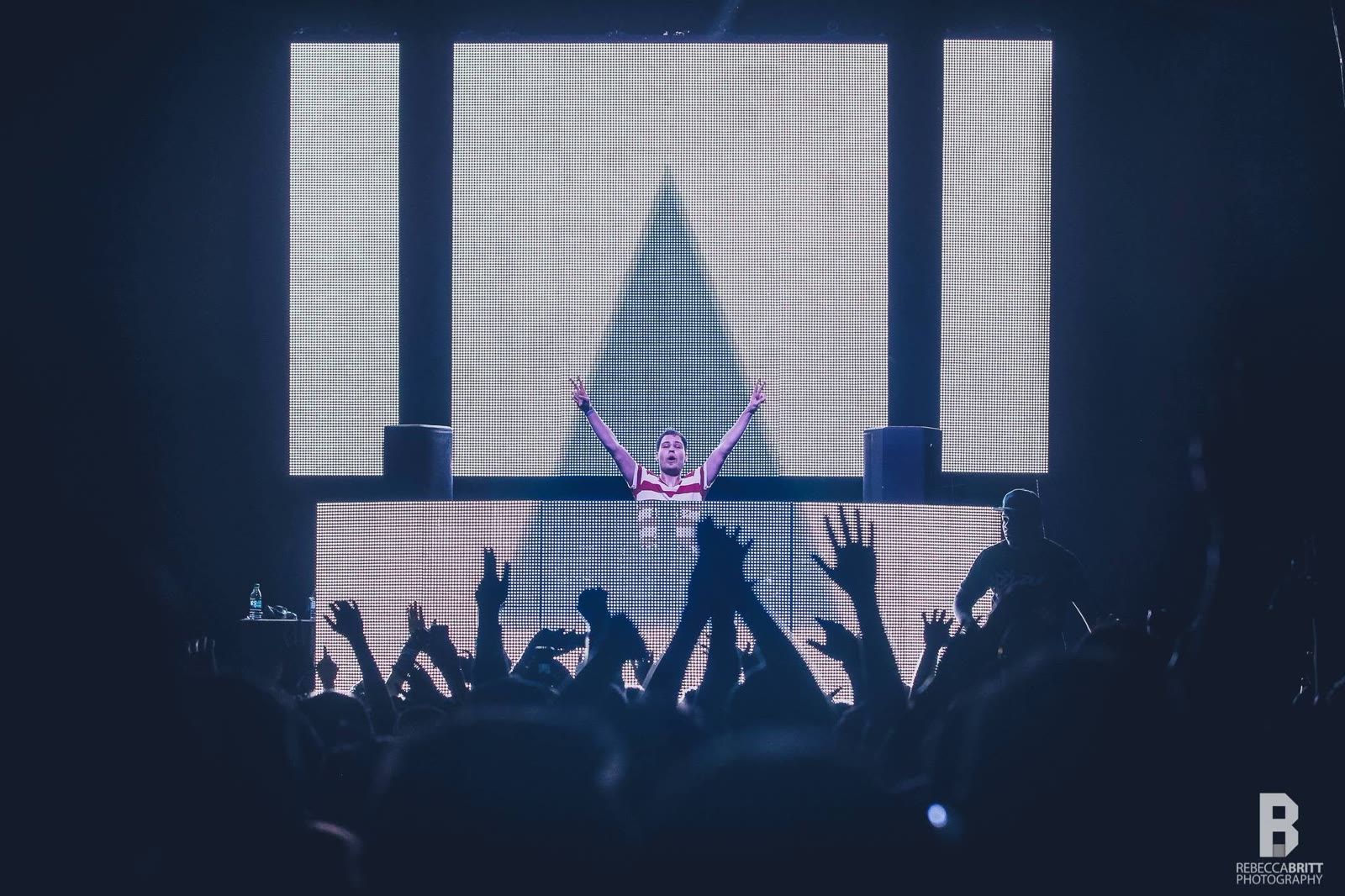 DJ Ori and the crowd with hands in the air