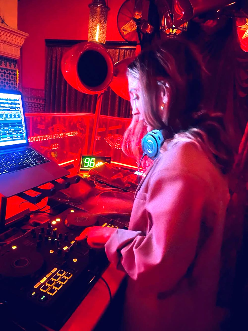 DJ RiRi mixing live at a Los Angeles event