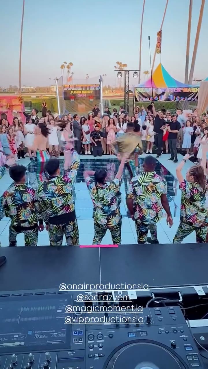 Daytime Outdoor Party — Big Crowd Under the Palms